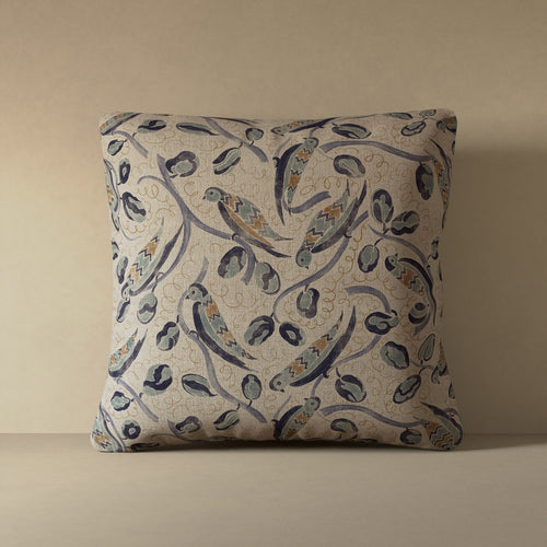 Linen accent pillow with French bird and botanical pattern in indigo, teal, and hazelnut on natural flax ground