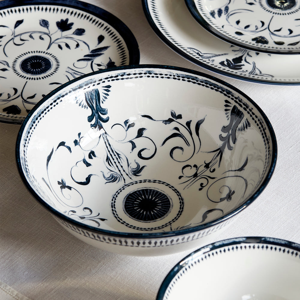 Lemieux et Cie Bruges Porcelain Large Bowl in hand-painted blue and white floral motif, ceramic serving bowl shown with matching dinnerware on neutral linen.