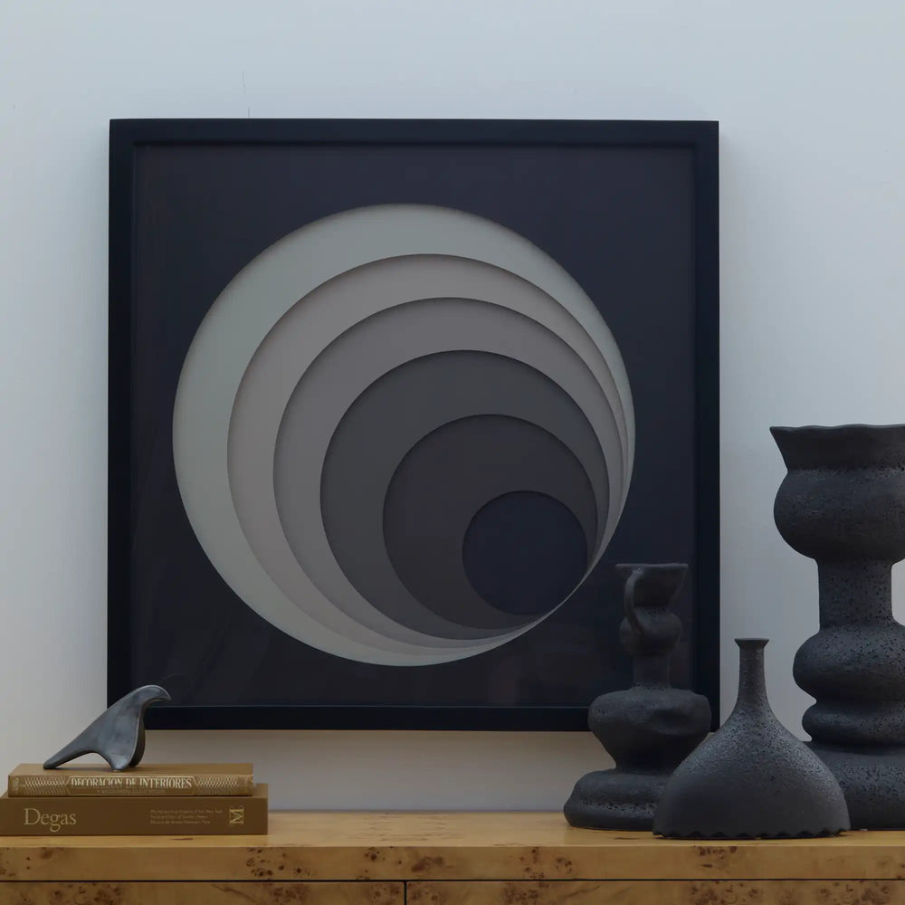 Lemieux et Cie Composition Tonale No. 4, framed artwork with concentric circular forms in graduated neutral tones, displayed on wood surface with ceramic vessels.