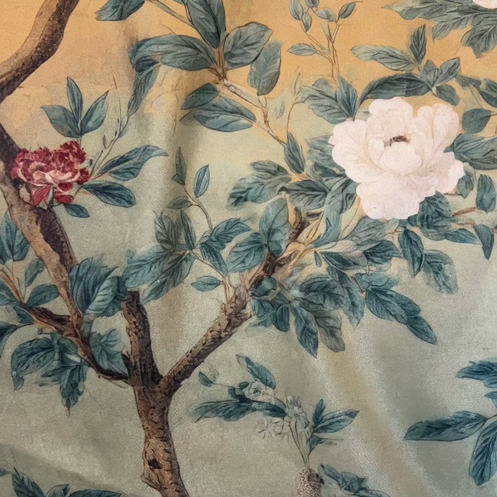 Lemieux et Cie Fresco Floral Velvet Pillow in warm ochre with botanical motif, decorative cushion in draped soft light showing detailed surface texture.