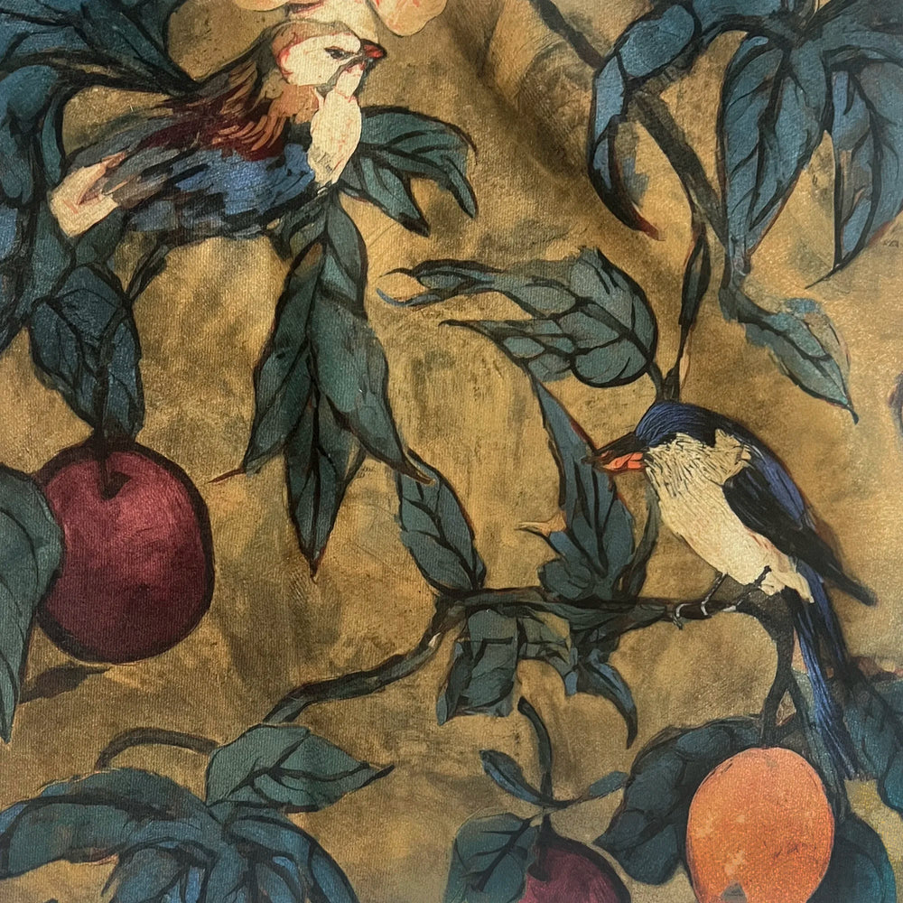 Lemieux et Cie Plum Garden Velvet Pillow in ochre with birds and fruit motif, close-up detail of decorative pillow surface showing painterly chinoiserie pattern.