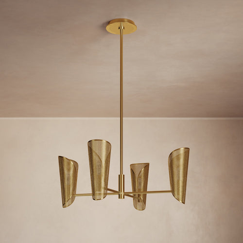 Lemieux et Cie Falaise Chandelier with perforated conical shades in warm brass finish, five-arm pendant suspended against neutral plaster walls and ceiling.