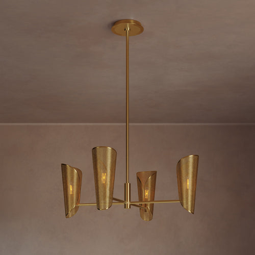 Lemieux et Cie Falaise Chandelier with perforated shades and slim arms, suspended in a room with neutral plaster walls and warm light.