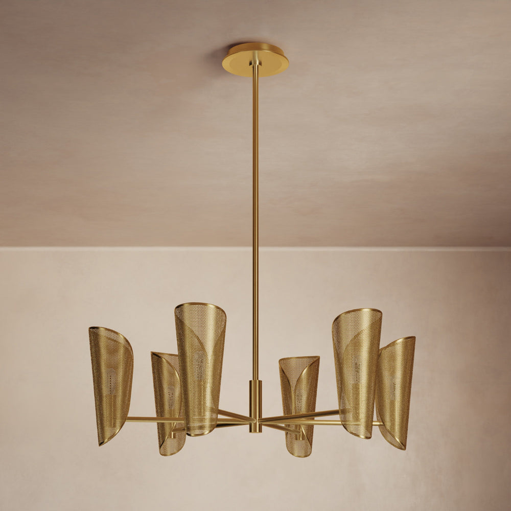 Lemieux et Cie Cluny Chandelier in brass with perforated shades, sculptural multi-arm pendant hung in a room with neutral plaster walls and ceiling.