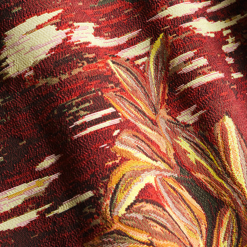 Oasis Grenat indoor-outdoor tapestry fabric by Metaphores in garnet red with golden and coral foliage
