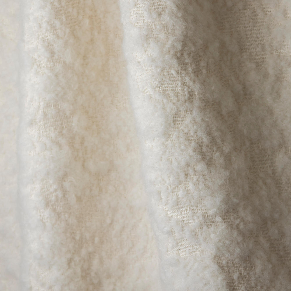 Nuvole Neige boucle upholstery fabric by Metaphores, part of Hermes' textile division, in snowy white