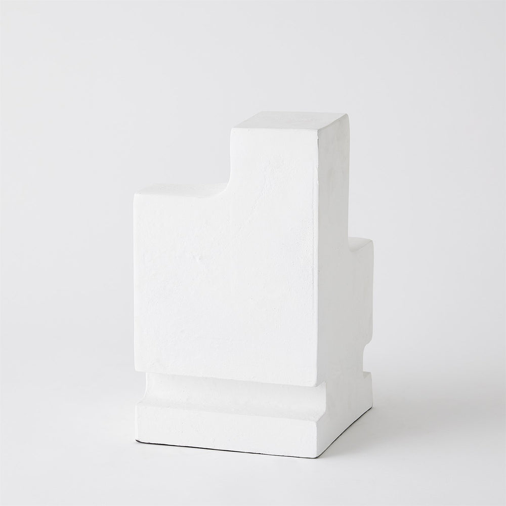 Lemieux et Cie La Structure Sculptural Pillar Holder in white, architectural stepped form, candle holder shown on white studio backdrop.
