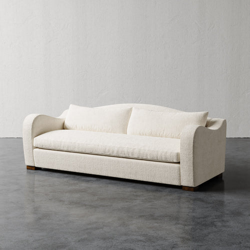 Lemieux Et Cie Elodie Sofa - Bench Seat (Made-to-order) Beige sofa against a plain wall on a gray floor