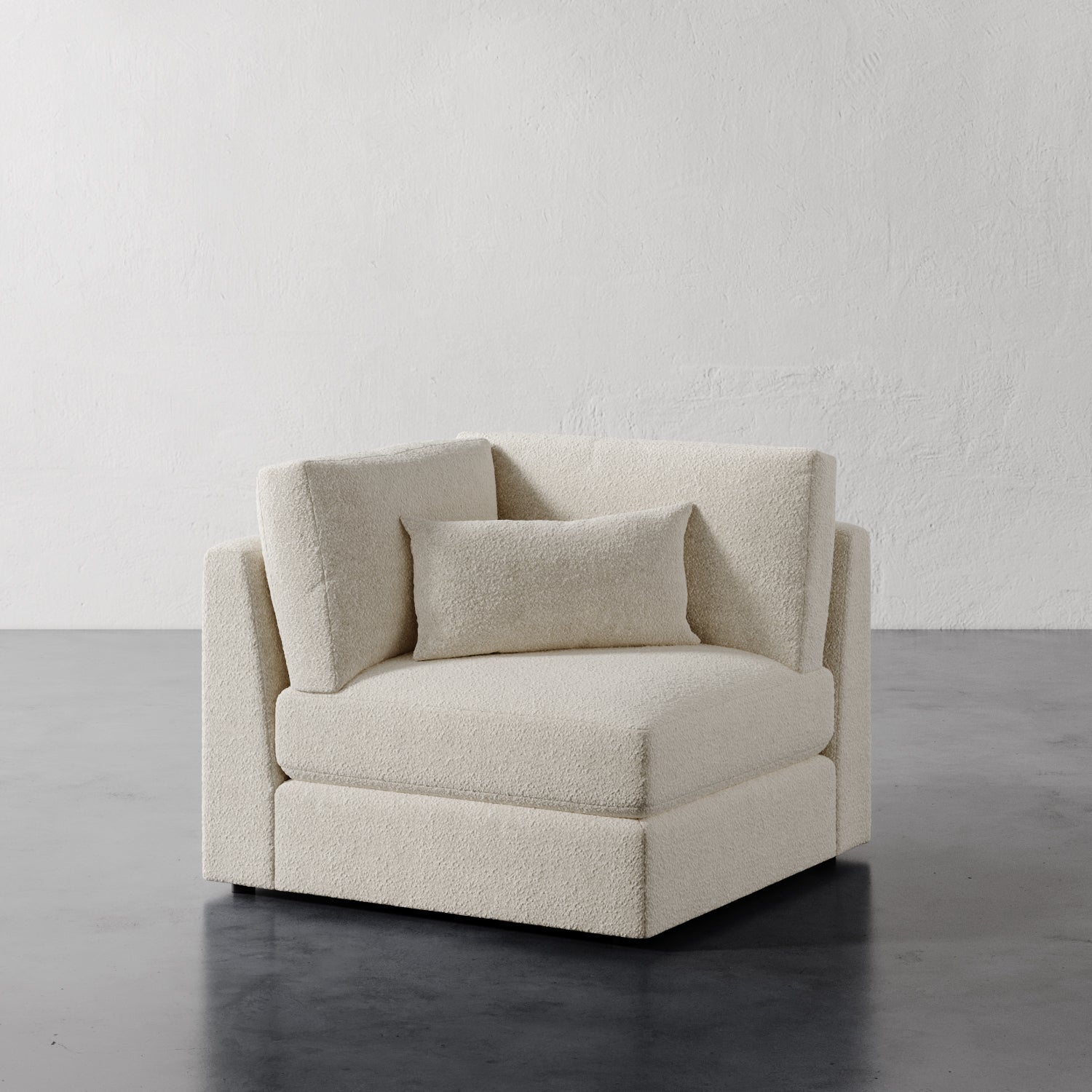 Lemieux Et Cie Lacroix Corner Chair Berber Cream velvet chair against a plain white wall.