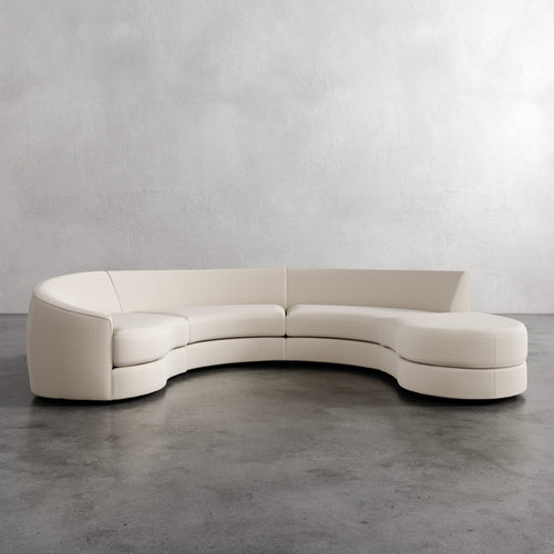 Lemieux Et Cie Rulmann 4-Piece Left Sectional Curved beige sofa against a plain wall