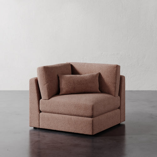 Lemieux Et Cie Lacroix Corner Chair deep pinkish-brown velvet chair against a plain white wall.