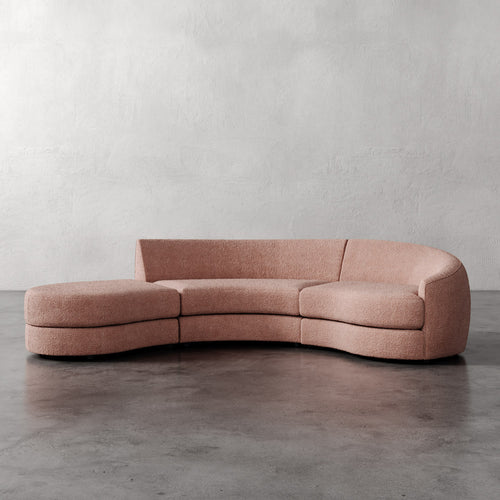 Lemieux Et Cie Rulmann 3-Piece Right Sectional  Curved pink sofa against a plain wall
