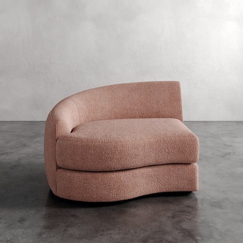 Lemieux Et Cie Rulmann Left Arm Chair  Pink textured sofa on a gray floor with a neutral background