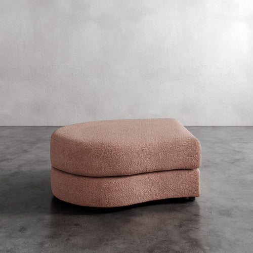 Lemieux Et Cie Rulmann Left Ottoman
 Pink ottoman on a gray floor with a plain wall background