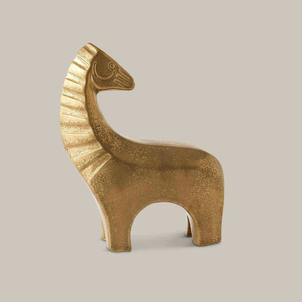 Lemieux et Cie sculptural horse figurine in warm textured finish, decorative object shown on neutral studio backdrop