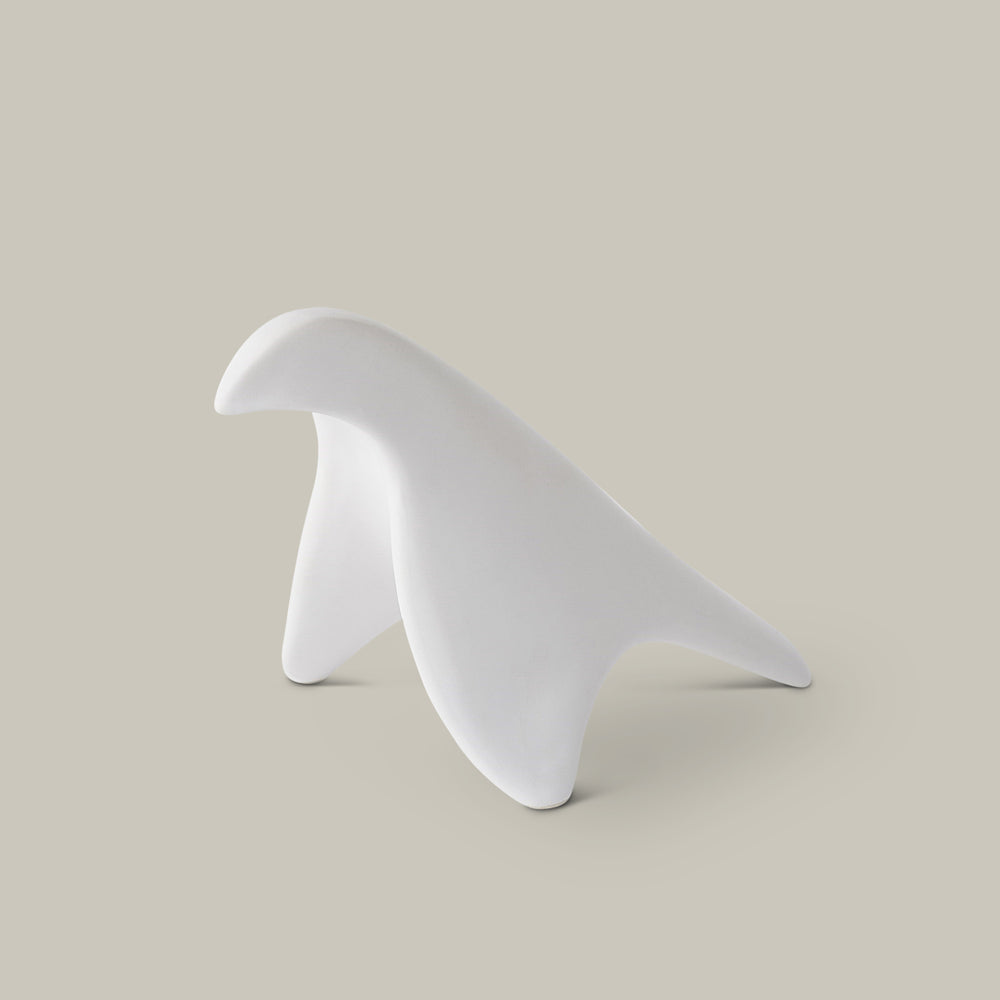 Lemieux et Cie sculptural bird object in white, smooth organic form shown on neutral studio backdrop