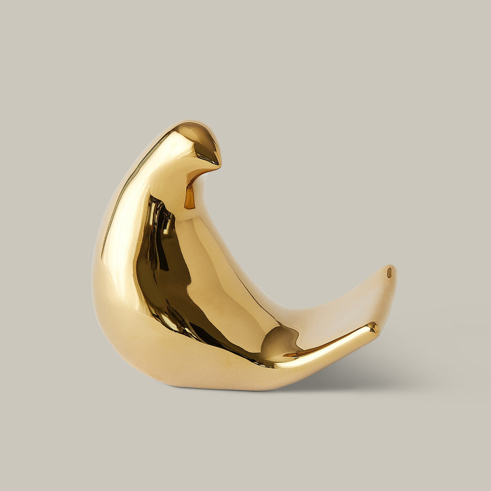 Lemieux et Cie bird object in polished finish, sculptural decorative piece shown on neutral studio backdrop.