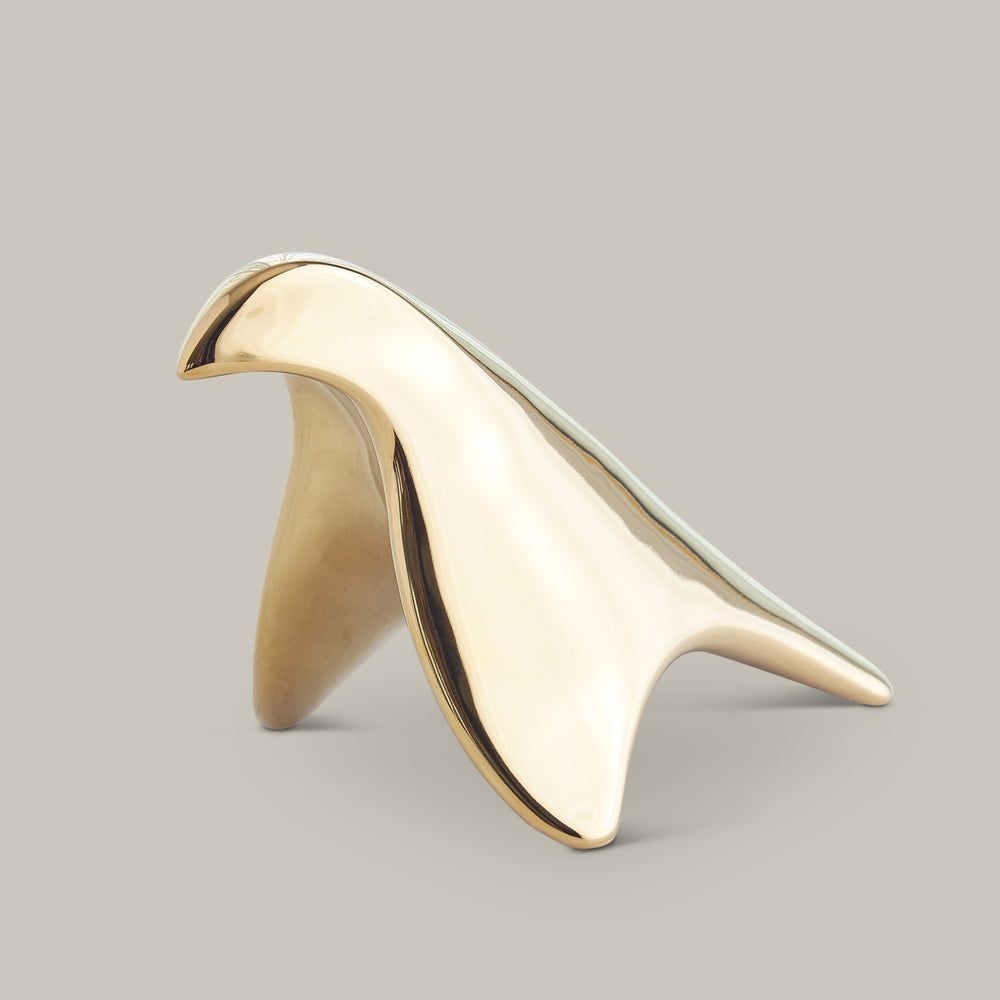 Lemieux et Cie sculptural bird object in polished finish, organic curved form shown on neutral studio backdrop.