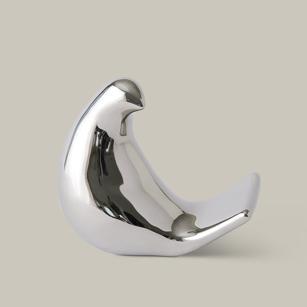 Lemieux et Cie sculptural bird object in polished finish, decorative accessory with organic curved form, shown on neutral studio backdrop.