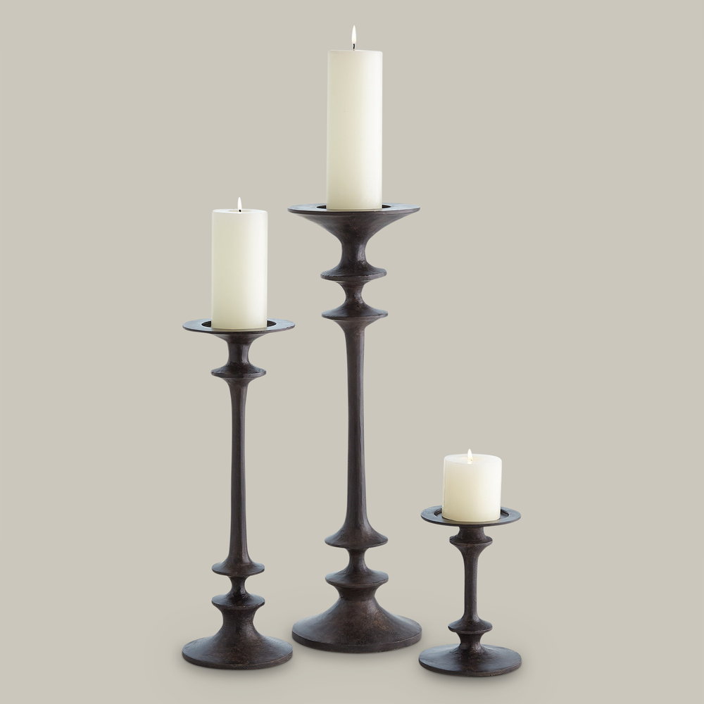 Lemieux et Cie Théophile Candle Holders in dark hand-forged finish, sculptural turned forms in three heights, shown on neutral studio backdrop