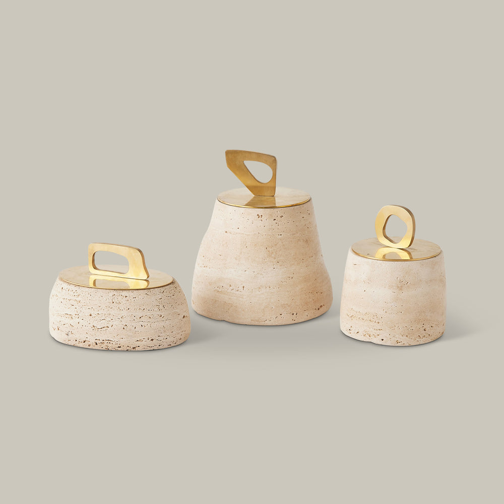 Lemieux et Cie Bocal Lidded Pot in travertine, sculptural ceramic vessel with geometric brass handle, shown on neutral studio backdrop.