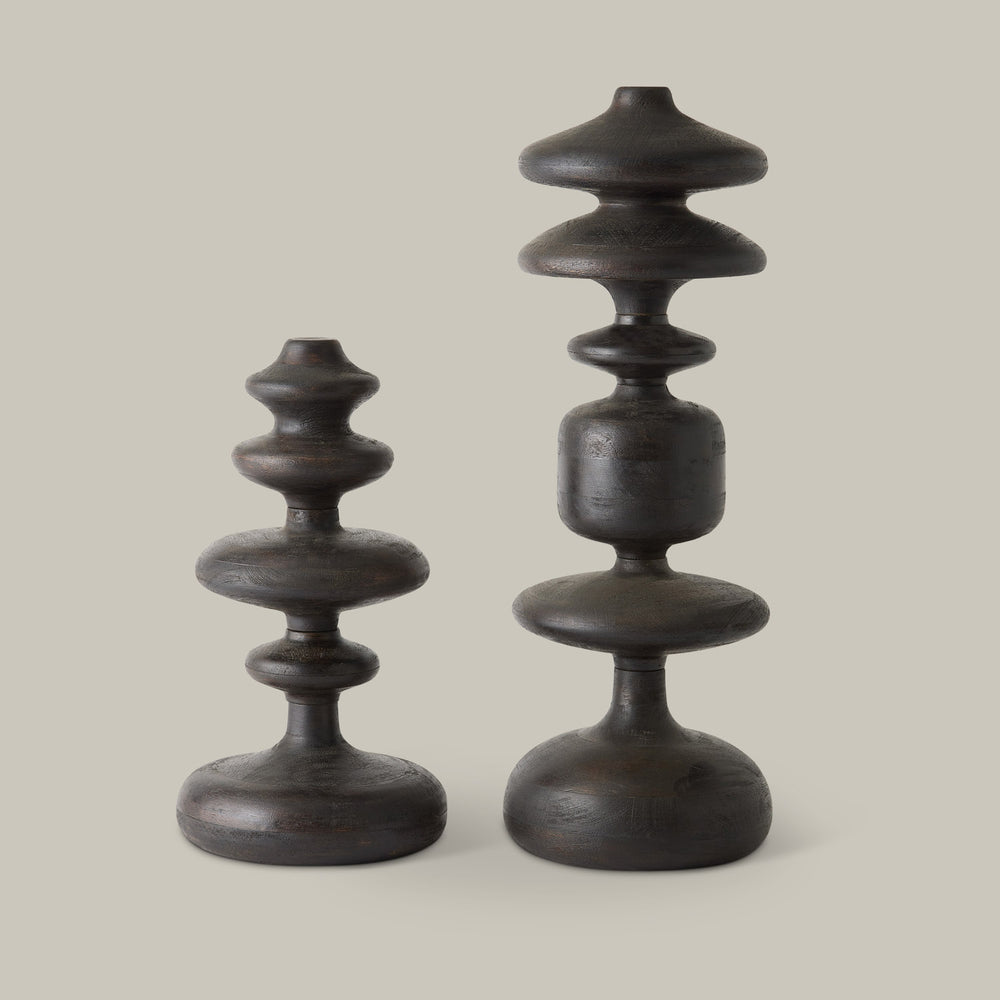 Lemieux et Cie Romain Totems, sculptural turned forms with stacked discs in dark finish, shown on neutral studio backdrop.