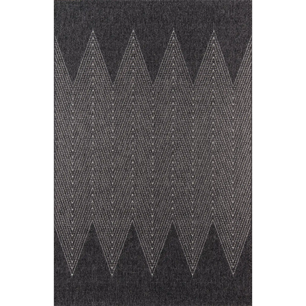 Lemieux et Cie Roanne Rug in charcoal with chevron pattern, hand-knotted New Zealand wool rug shown on white studio backdrop.