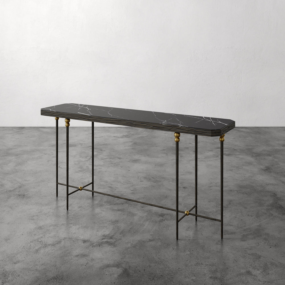 Lemieux et Cie Cambert Console with honed Nero Marquina marble top and bronze iron frame with brass accents, shown on concrete flooring
