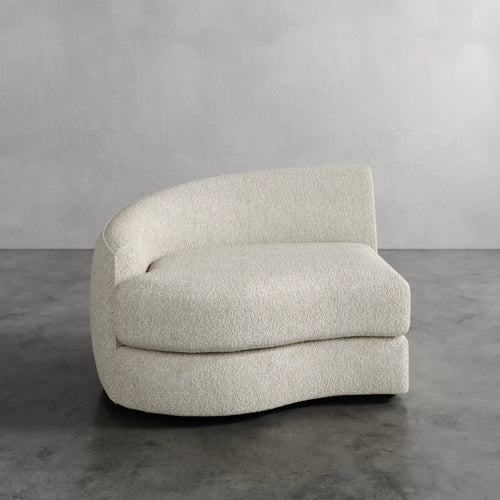Lemieux Et Cie Rulmann Left Arm Chair Modern beige sofa against a gray wall