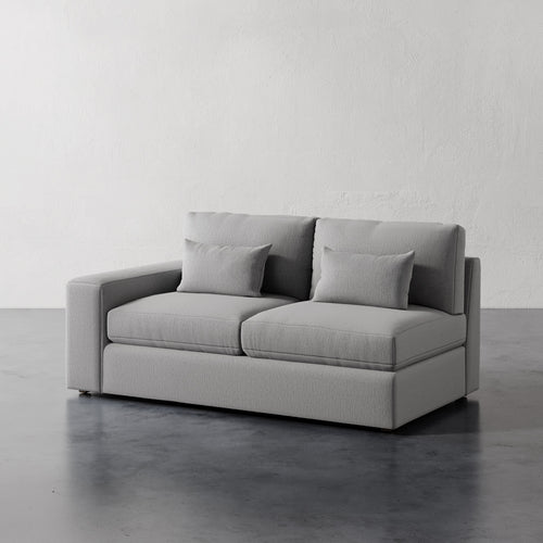 Lemieux Et Cie Lacroix Left or Right Arm Loveseat A dark green Lacroix left or right arm loveseat with two seat cushions and two bolster pillows, set against a neutral background.