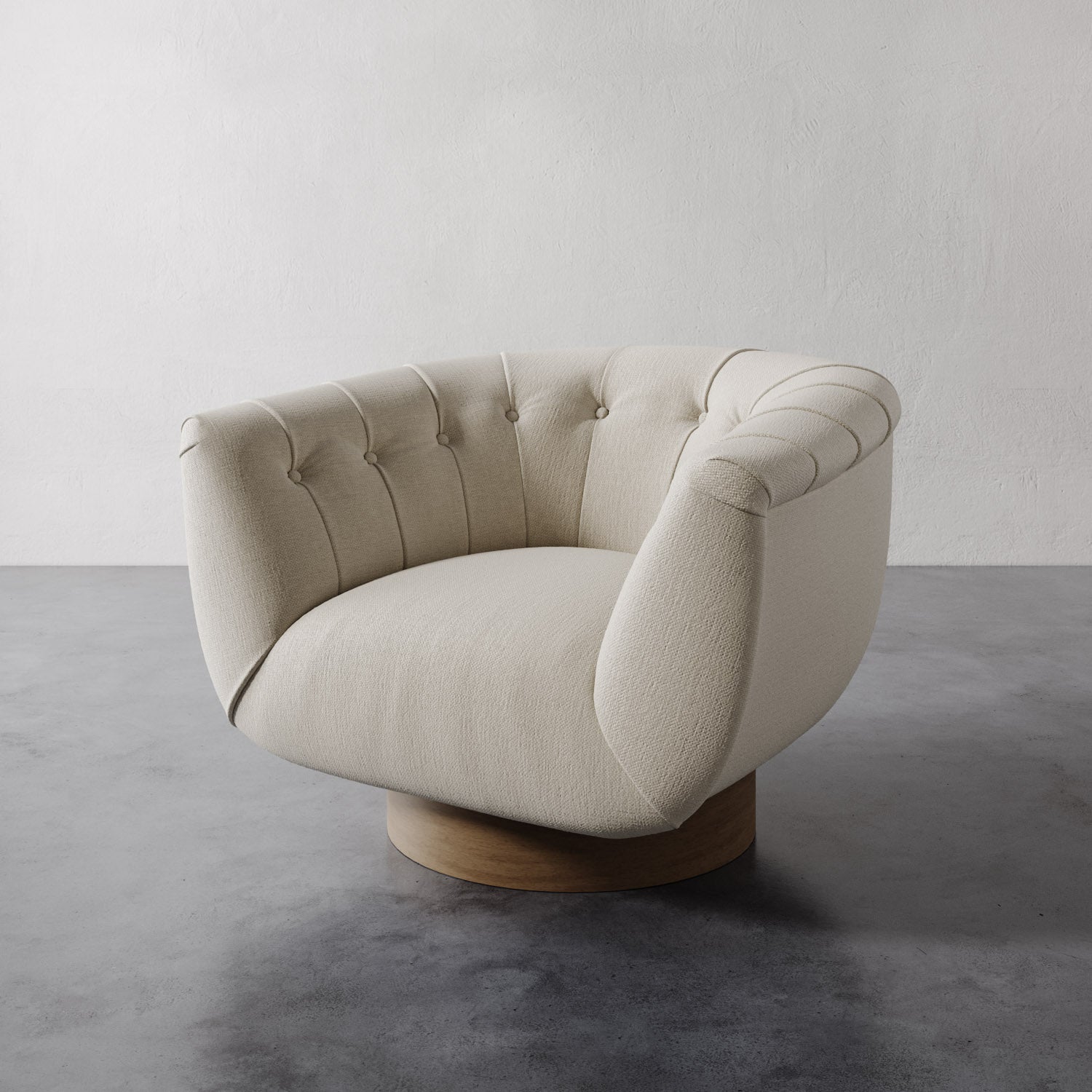 Chunky natural color Lemieux et Cie Lune Swivel Chair with a rounded tufted back and sculptural form set against a white wall.