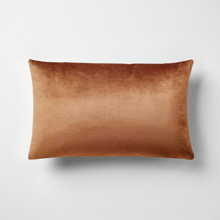 Naomi solid velvet lumbar pillow in amber, 14 by 22 inches, with a subtle sheen and striated pile