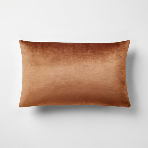 Naomi solid velvet lumbar pillow in amber, 14 by 22 inches, with a subtle sheen and striated pile
