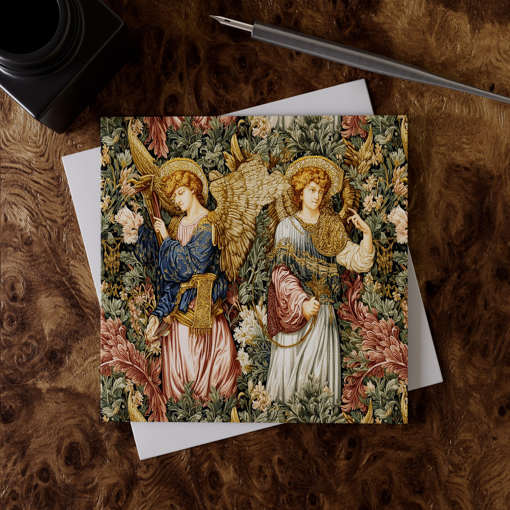 Lemieux et Cie Angels Jubilee Greeting Card featuring angels in rich tapestry design on fine art linen paper, styled on figured wood surface with pen and envelope.