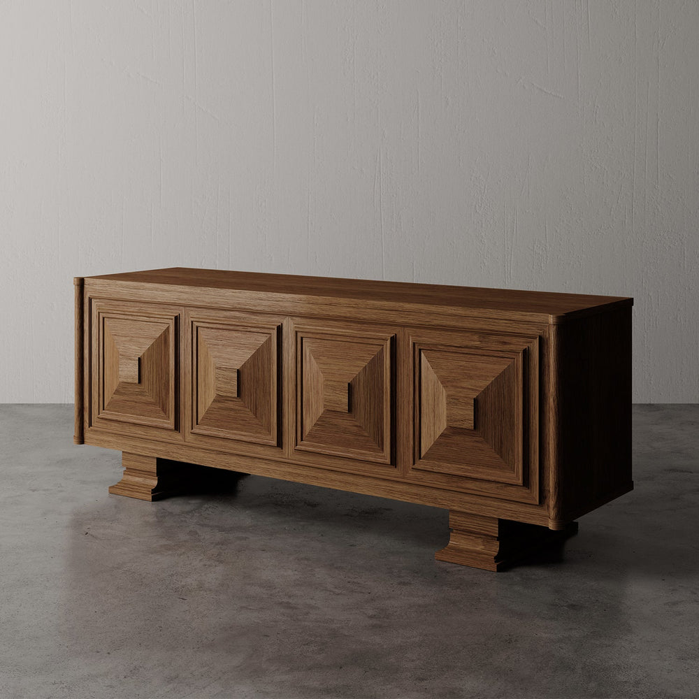 Lemieux et Cie Voltaire Sideboard, hand-crafted credenza with geometric panel detailing, shown on concrete floor against neutral textured walls in soft light.