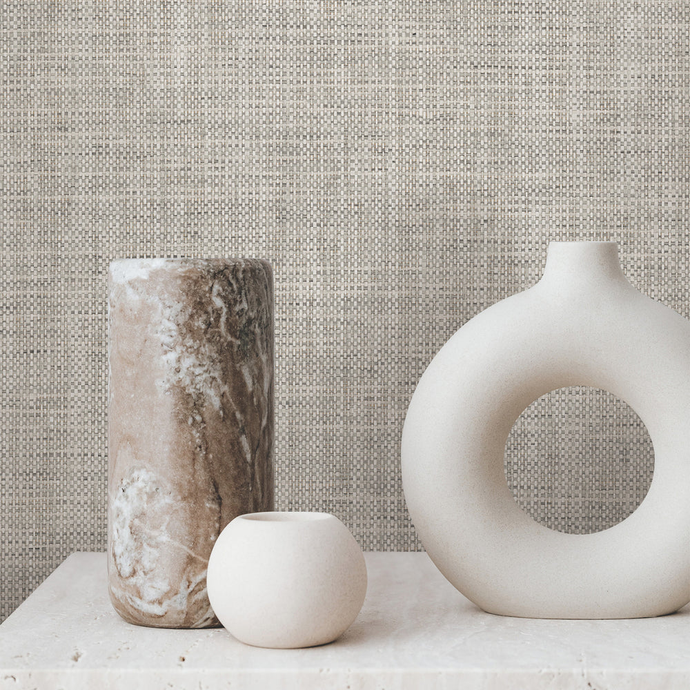 Lemieux et Cie Kami Paperweave in gray mist, woven wallcovering in neutral tones, styled with ceramic vessels on stone surface