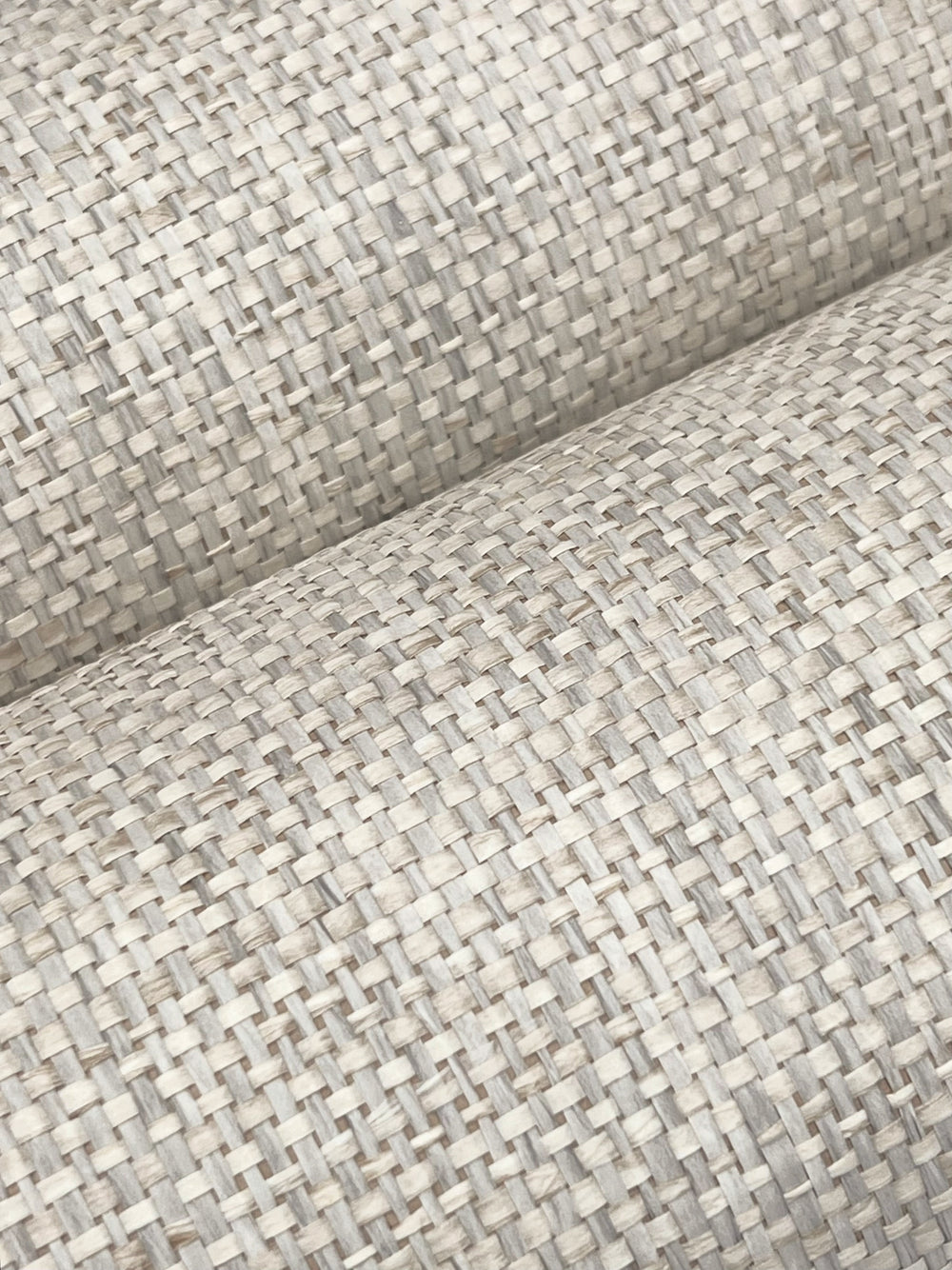 Lemieux et Cie Kami Paperweave in charcoal gray, handcrafted woven textile swatch in warm neutral tones, draped in soft folds on white backdrop.
