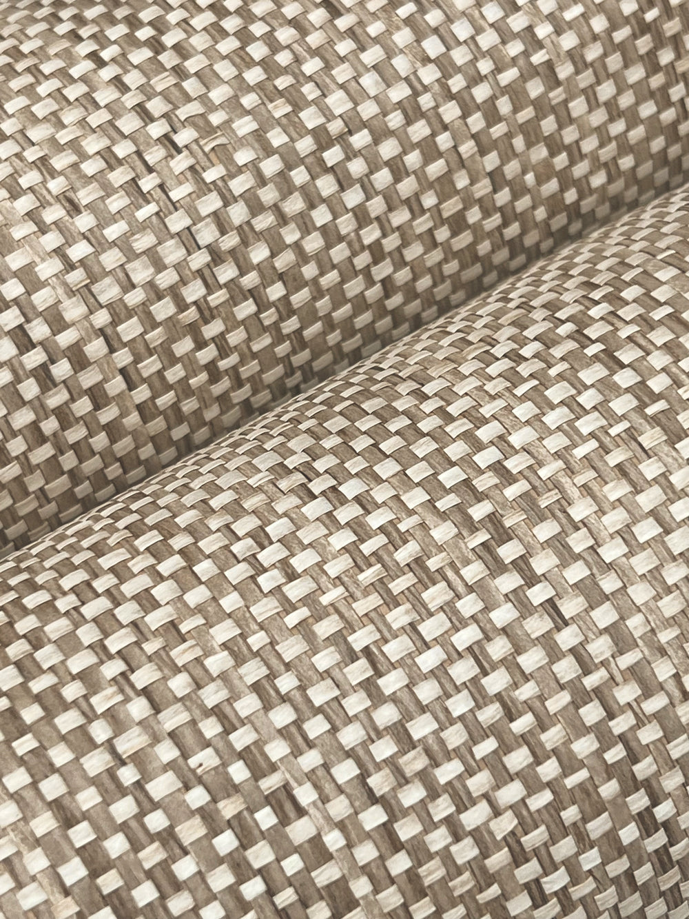 Lemieux et Cie Zora Waves in black on tan brown, woven textile swatch with brushstroke wave pattern, shown on white studio backdrop.