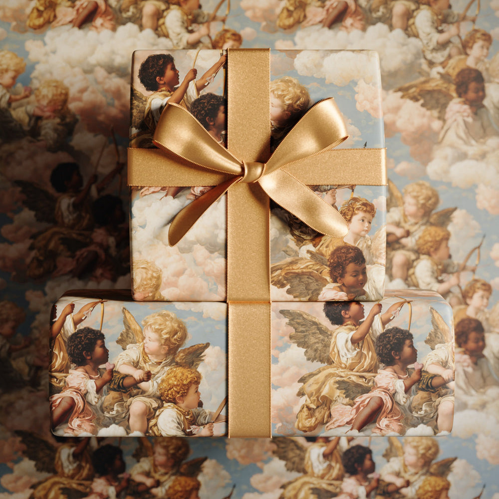 Lemieux et Cie Grecian Cherub Gift Wrapping Paper with golden ribbon bow, featuring Renaissance-inspired celestial figures and clouds in soft rosy light.