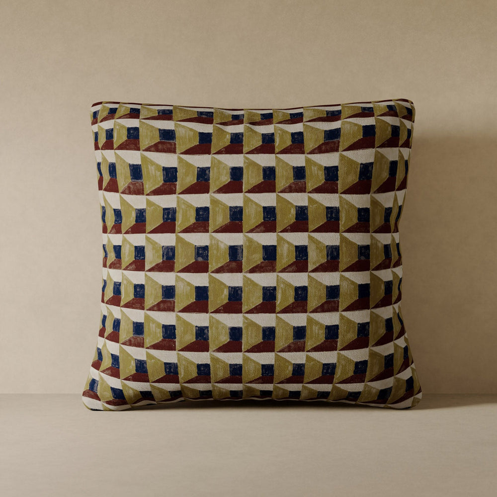 Lemieux et Cie Les Cubes Velvet Pillow in olive, rust and navy geometric pattern, accent pillow in performance velvet, shown on neutral stone surface.