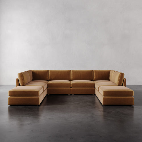Lemieux Et Cie Chanaux 8-Pc Sectional
Brown sectional sofa on a gray floor with a plain white wall background