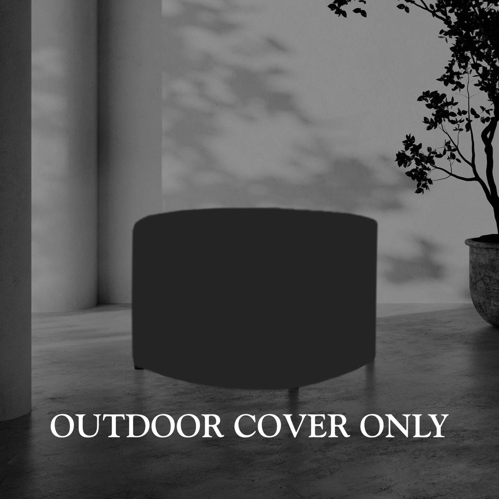 Lemieux et Cie Hudson outdoor cover in charcoal, fitted furniture cover shown on stone floor beside white column and plantings.