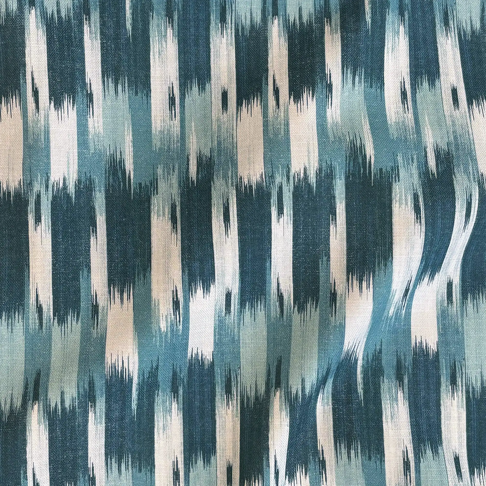 Lemieux et Cie Outdoor Pillow in Teal French Flamme, ikat pattern in teal, ivory and blush tones, textile swatch shown with visible weave.