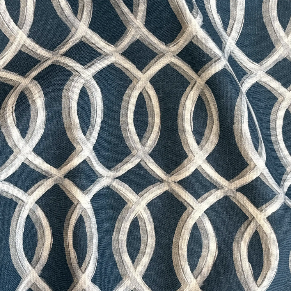 Lemieux et Cie Gatework Navy Outdoor Pillow, geometric trellis pattern in ivory on deep blue, textile swatch close-up detail.