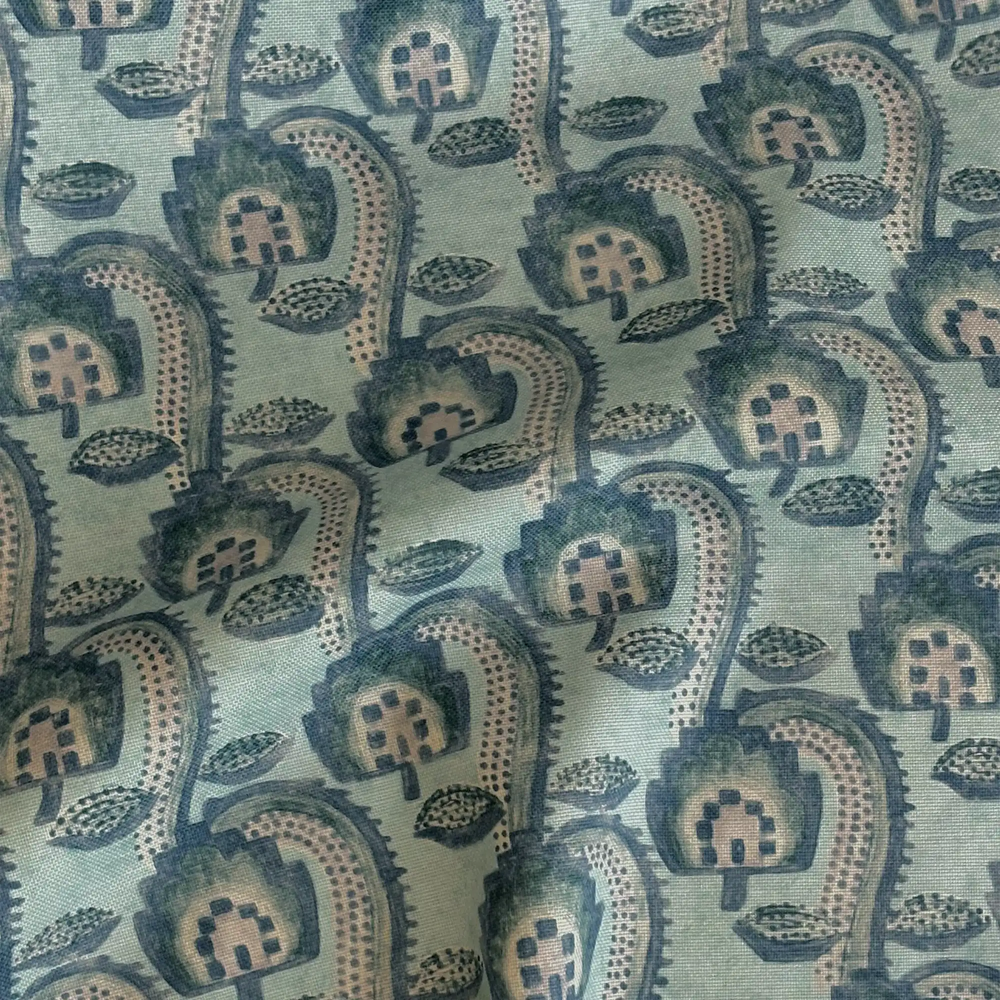 Lemieux et Cie Outdoor Pillow in teal with hand-blocked floral motif, textile swatch shown in soft daylight with draped folds.