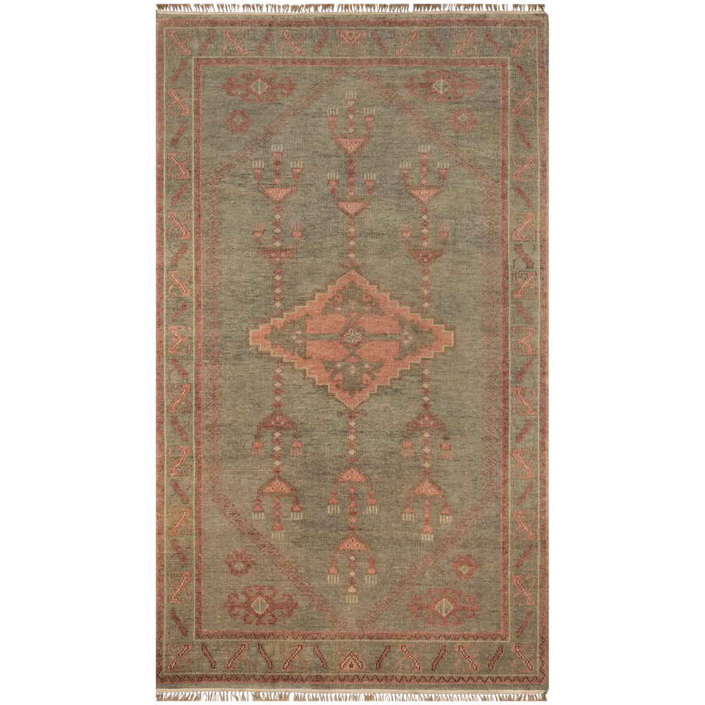 Lemieux et Cie Kouang rug in sage and coral hand-knotted wool with geometric motifs, vintage-inspired carpet with fringe shown on white backdrop.