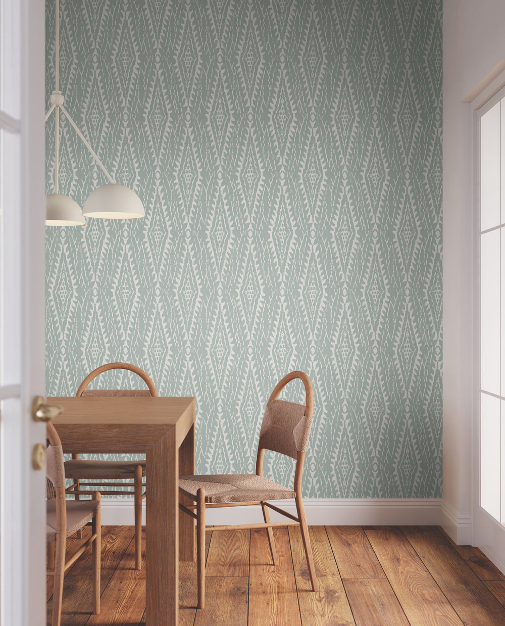 Lemieux et Cie Rousseau Paperweave in indigo and porcelain white, organic paper wallcovering, installed in a dining room with wood floors and woven chairs.