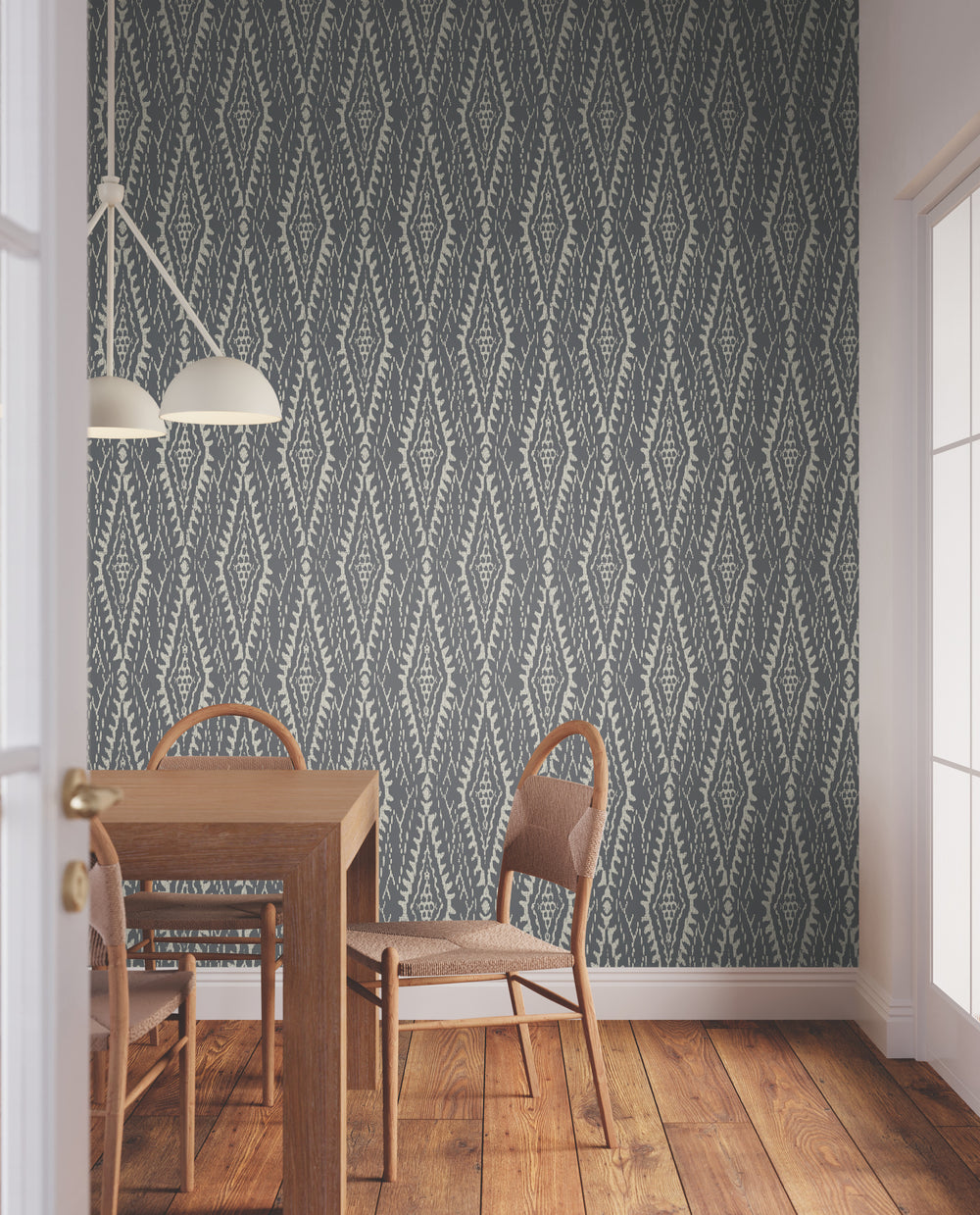 Lemieux et Cie Rousseau Paperweave in fawn beige with cream, organic paper wallcovering with diamond tapestry weave, shown in a dining room with wood floors and adjustable sconce.