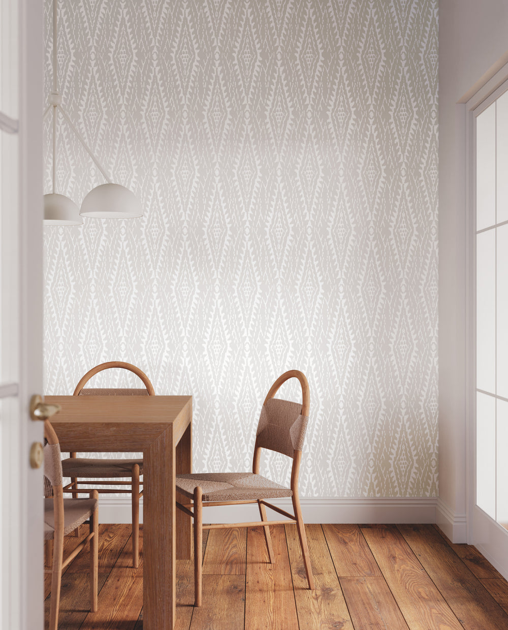 Lemieux et Cie Rousseau Paperweave in warm gray with powder white, organic paper wallcovering, diamond ikat pattern on wall beside wood dining table and chairs with arched backs on wood flooring.