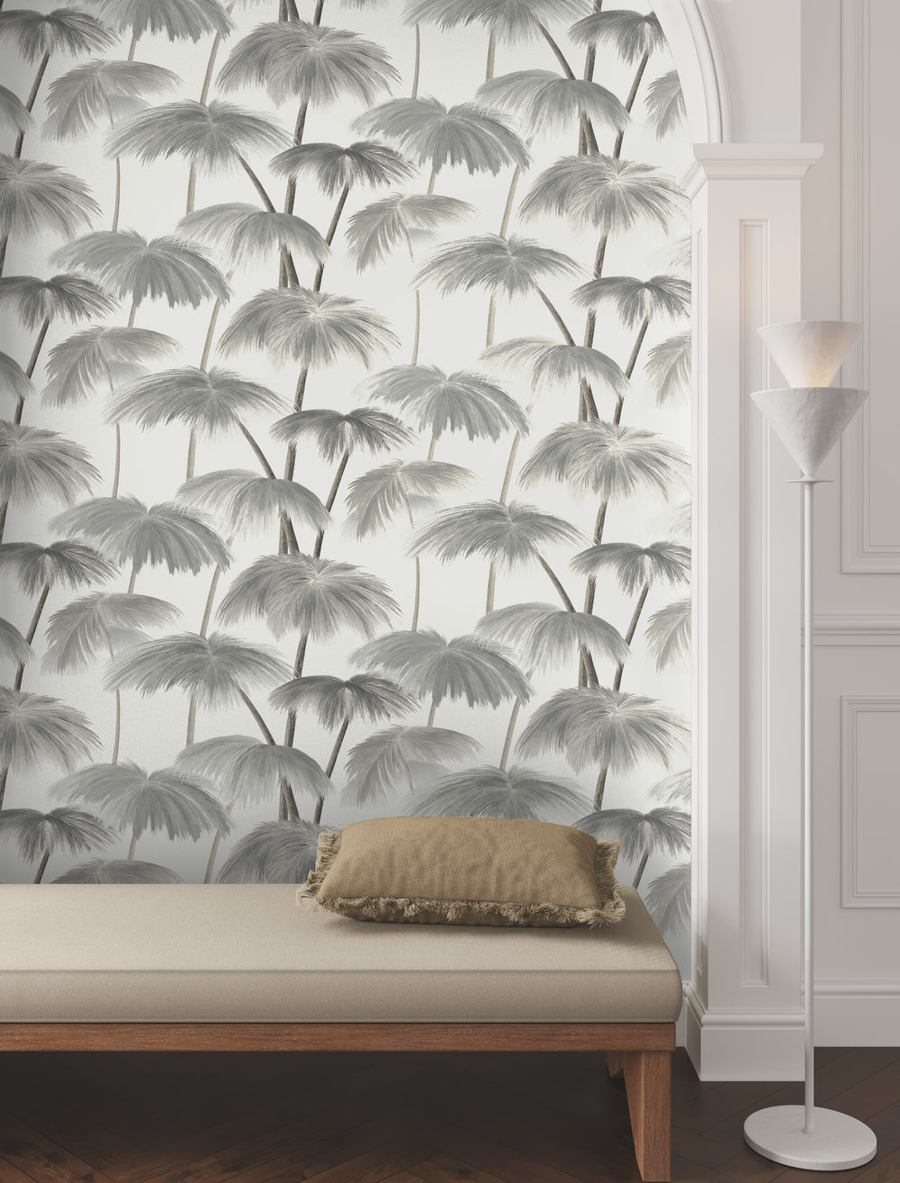 Lemieux et Cie Plein Air Palms wallpaper in vintage neutrals on cream white, palm motif covering an arched wall above an upholstered bench with wood floor and white trim.